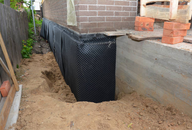 Happy homeowners after waterproofing job in Whiteside
